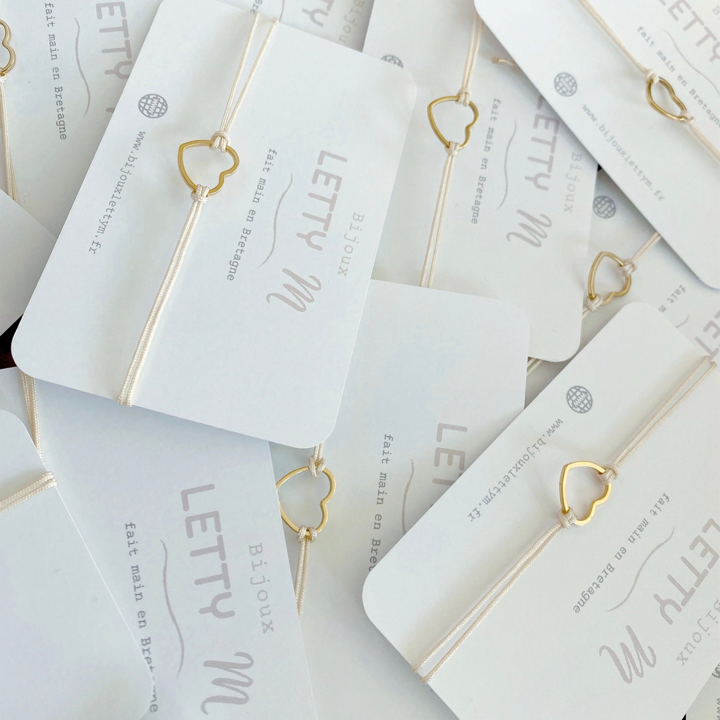 Bracelet en cordon avec coeur en acier inoxydable doré pour femme